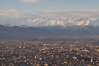 High angle view of illuminated cityscape against sky