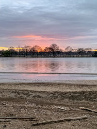 Scenic view of lake against sky during sunset