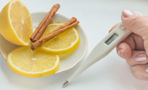 Close-up of hand holding fruit