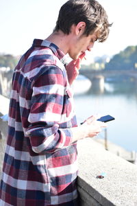 Young man using mobile phone