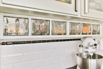 Full frame shot of containers on shelves