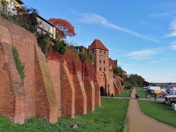 Panoramic view of old building against blue sky