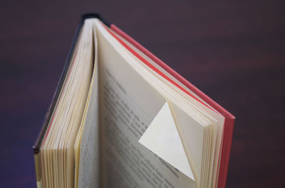 Close-up of folded page in book on table