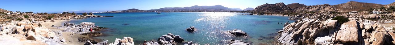 water, beauty in nature, panoramic, scenics - nature, sea, tranquil scene, tranquility, mountain, sky, nature, rock, no people, day, idyllic, rock - object, land, solid, non-urban scene, blue, outdoors, turquoise colored, bay