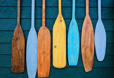 Directly above shot of oars on boardwalk