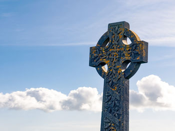 Low angle view of statue against sky