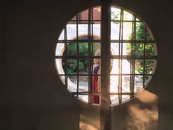 Close-up of silhouette person seen through window