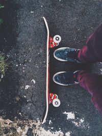 Low section of person standing on road