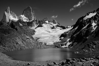 Panoramic view of lake and snowcapped mountains against sky