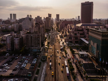 High angle view of traffic on road amidst buildings in city