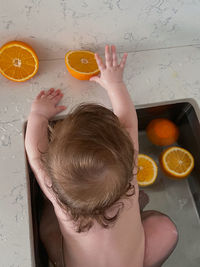 High angle view of baby in tube