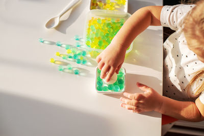 High angle view of child holding hands