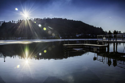 Scenic view of lake against sky at night