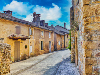 Alley amidst buildings in city