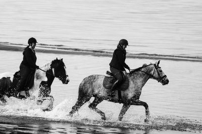 View of people running on beach