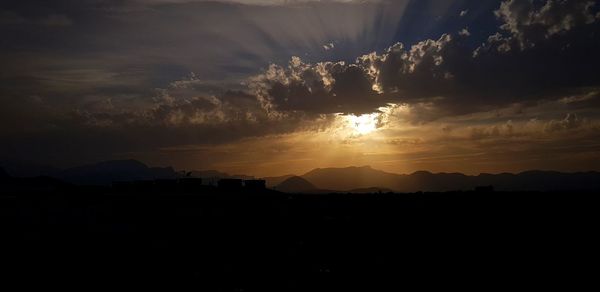 Scenic view of sunset over mountain