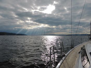 Scenic view of sea against storm clouds