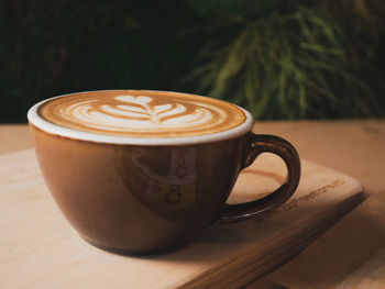 Close-up of cappuccino on table