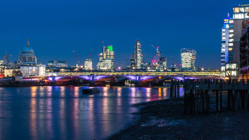 Illuminated city lit up at night