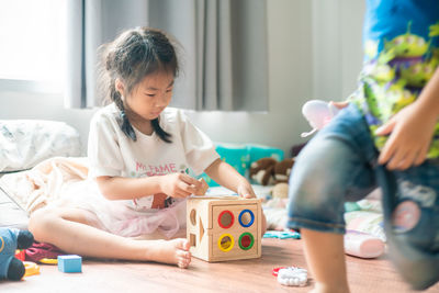 Children playing with toy at home