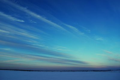 Scenic view of sea against sky during winter