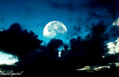 Low angle view of moon against cloudy sky