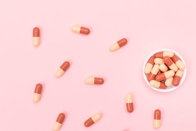 High angle view of multi colored pencils on white background