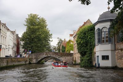 River amidst buildings against sky