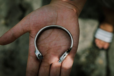 Close-up of man holding hand