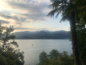 Scenic view of lake against sky at sunset