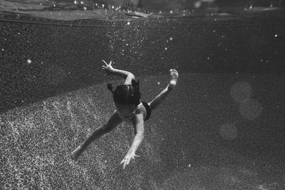 Close-up of girl swimming in pool