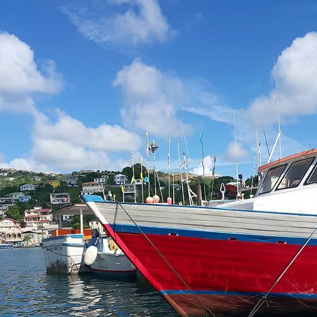 sky, nautical vessel, water, cloud - sky, transportation, boat, moored, mode of transport, cloud, built structure, building exterior, waterfront, architecture, cloudy, harbor, sea, day, flag, outdoors, no people