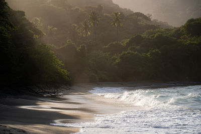 Scenic view of sea against mountain