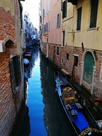 Boats moored in canal in old town