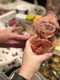 Cropped hand of woman holding drink