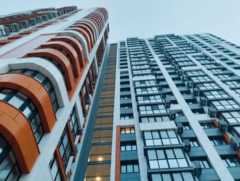 Low angle view of modern buildings against sky