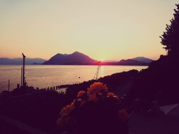 Scenic view of sea against clear sky during sunset