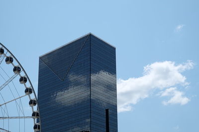 Low angle view of skyscraper against clear blue sky