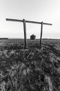 Lifeguard hut on field against clear sky