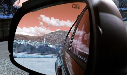 Reflection of cropped car on side-view mirror