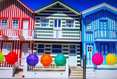 Multi colored balloons against building