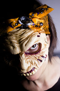 Close-up portrait of woman wearing mask