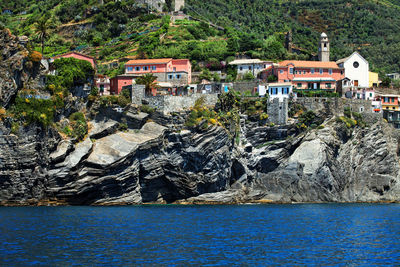 Buildings on mountain by sea at cinque terre