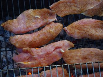 High angle view of meat on barbecue grill