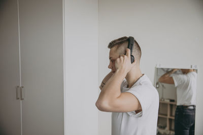 Woman putting headphones on