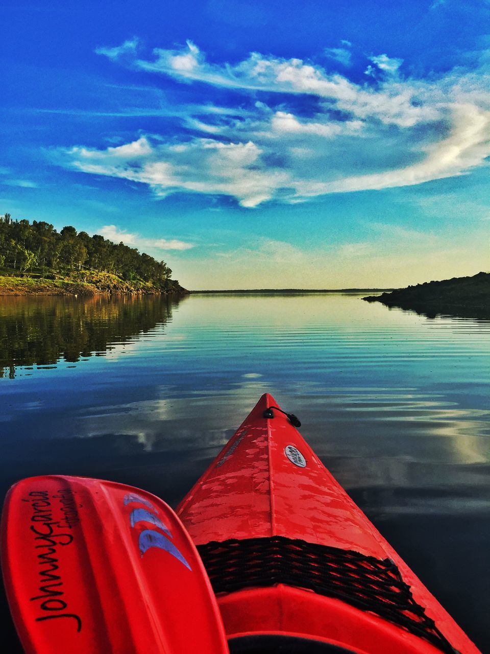 transportation, water, sky, mode of transport, nautical vessel, tranquil scene, tranquility, boat, cloud - sky, blue, scenics, red, beauty in nature, lake, reflection, nature, cloud, sea, tree, outdoors