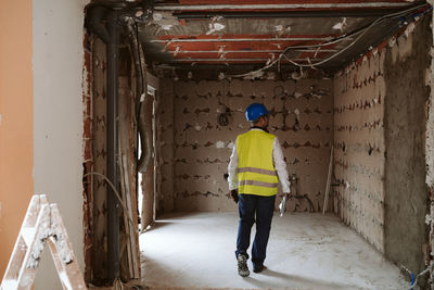 Foreman or architect working on blueprints on construction site. home improvement