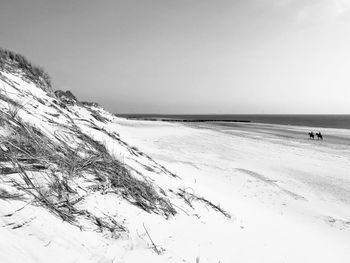 Scenic view of sea against sky during winter