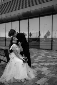 Portrait of woman standing in city