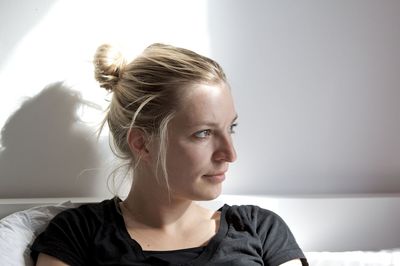 Close-up of young woman at home